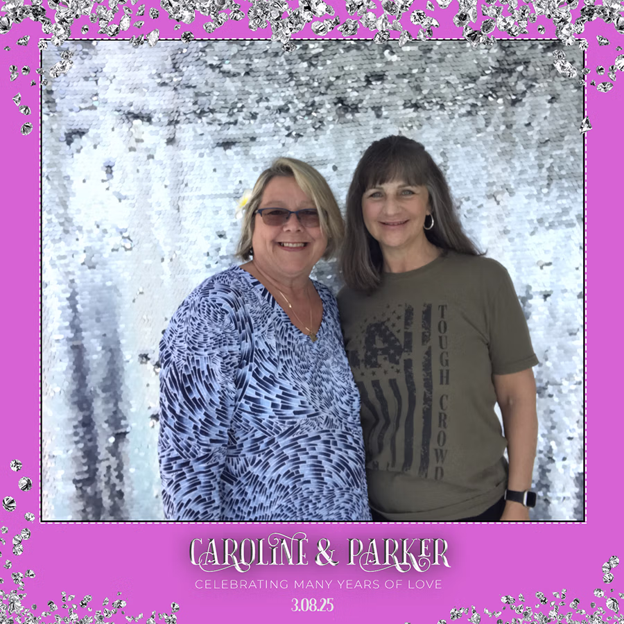 Two women posing in a photo booth photo from a private party with a DIY Magic Photo Booth Rental