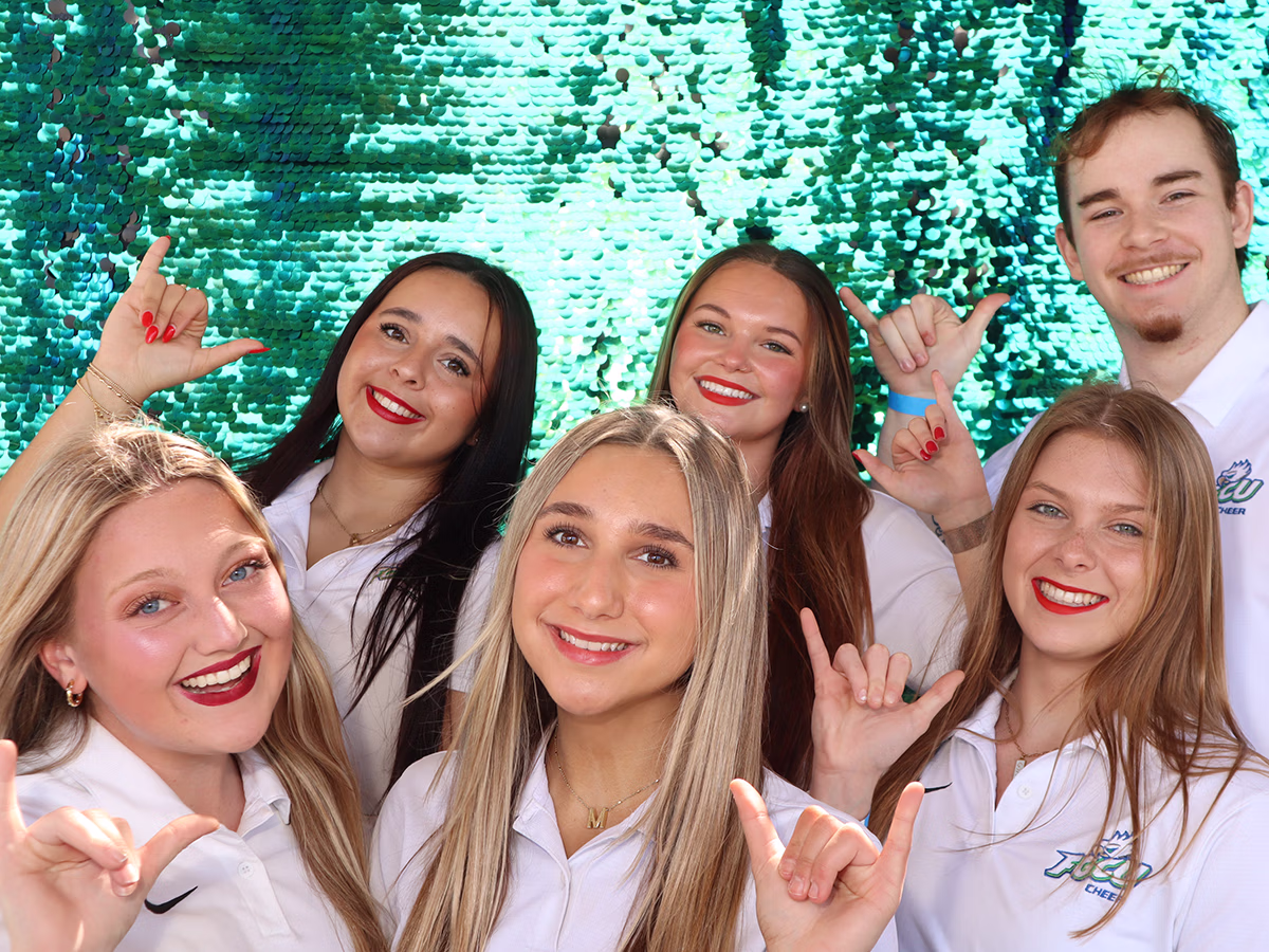 FGCU Cheer at FGCU Homecoming using their school events photo booth rental from Photo Magic Events