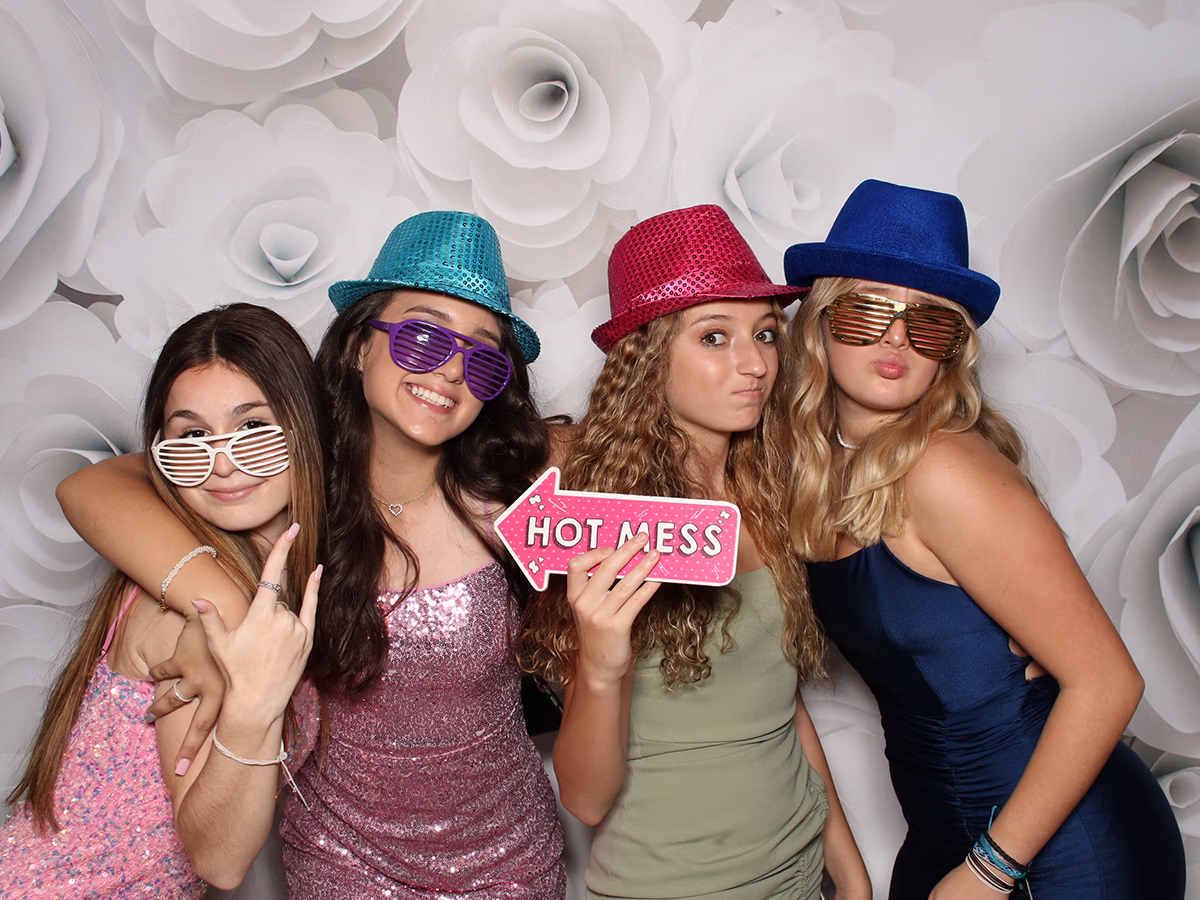 Group of teen girls posing in a Bat Mitzvah photo booth rental from Photo Magic Events