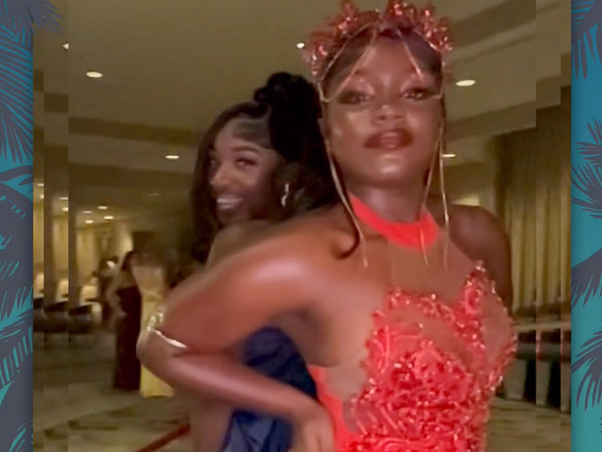 Two girls posing at their High School Prom in a Photo Magic Events 360 Photo Booth Rental