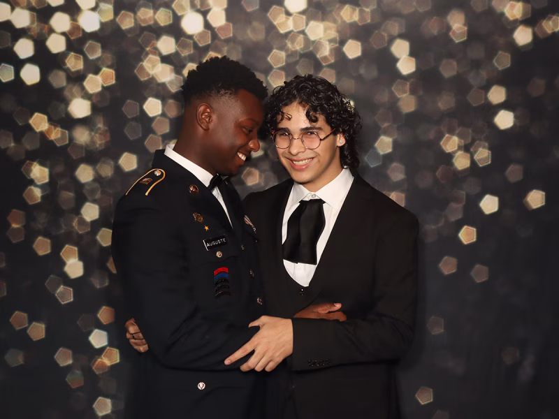 GGHS JR ROTC members embracing in their school events photo booth rental from Photo Magic Events