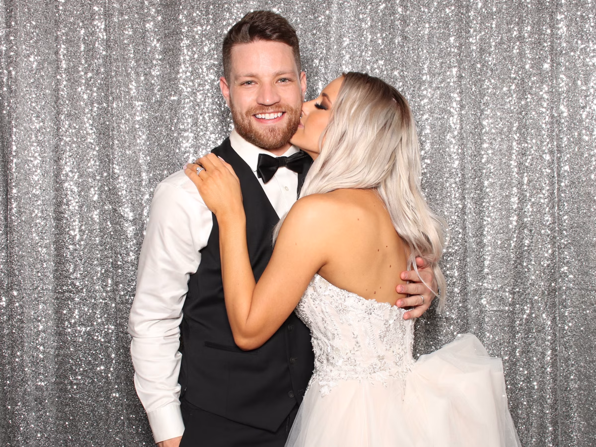 Newlyweds taking a moment to enjoy their Wedding Photo Booth Rental from Photo Magic Events