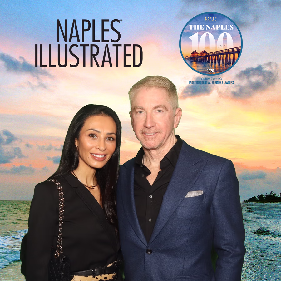 A couple at a corporate event smiling in a custom magazine cover with the event's logo