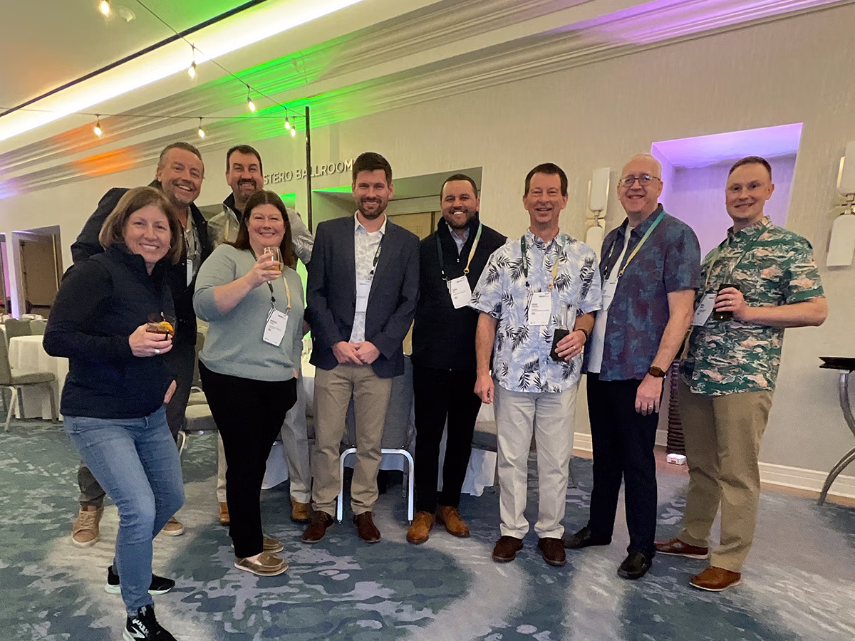 Roaming Magic Photo Booth Rentals capturing a group of attendees at a tradeshow event in Southwest Florida | Photo Magic Events
