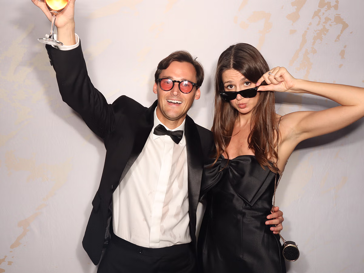 Wedding guests enjoying a Wedding Photo Booth Rental from Photo Magic Events